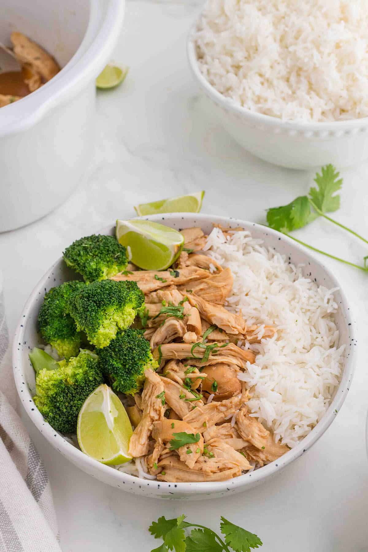 Honey garlic chicken on a plate, served with white rice and steamed broccoli.