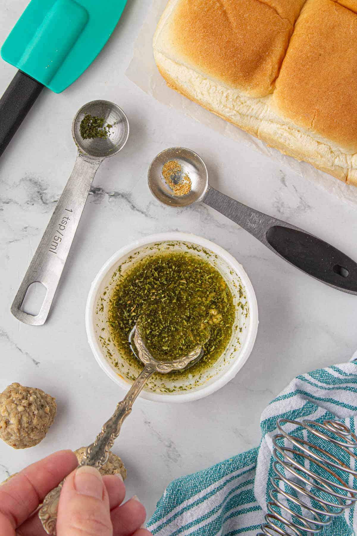 Melted butter mixed with seasonings in a small bowl.