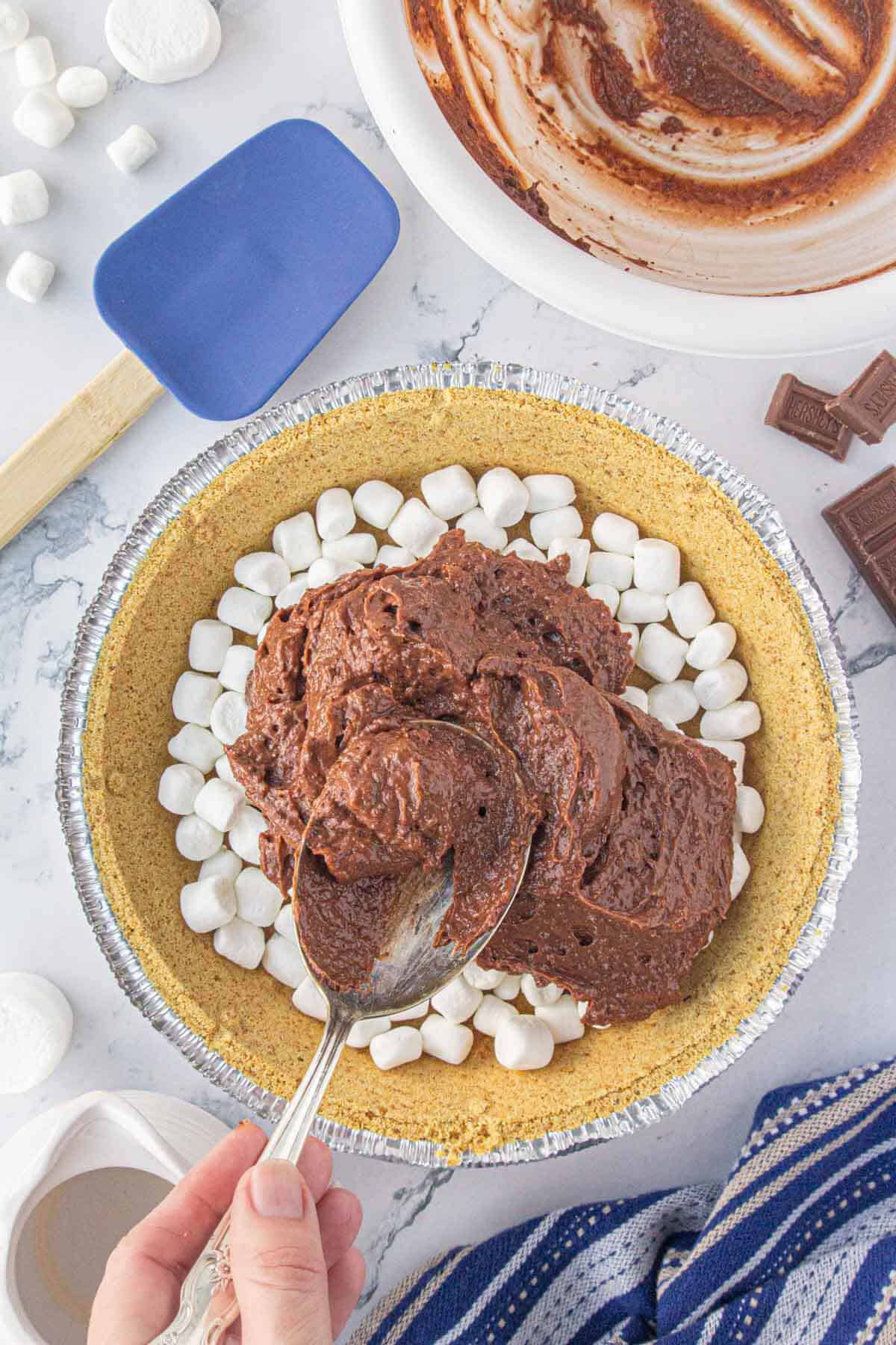 Chocolate pudding spooned into a graham cracker pie crust.