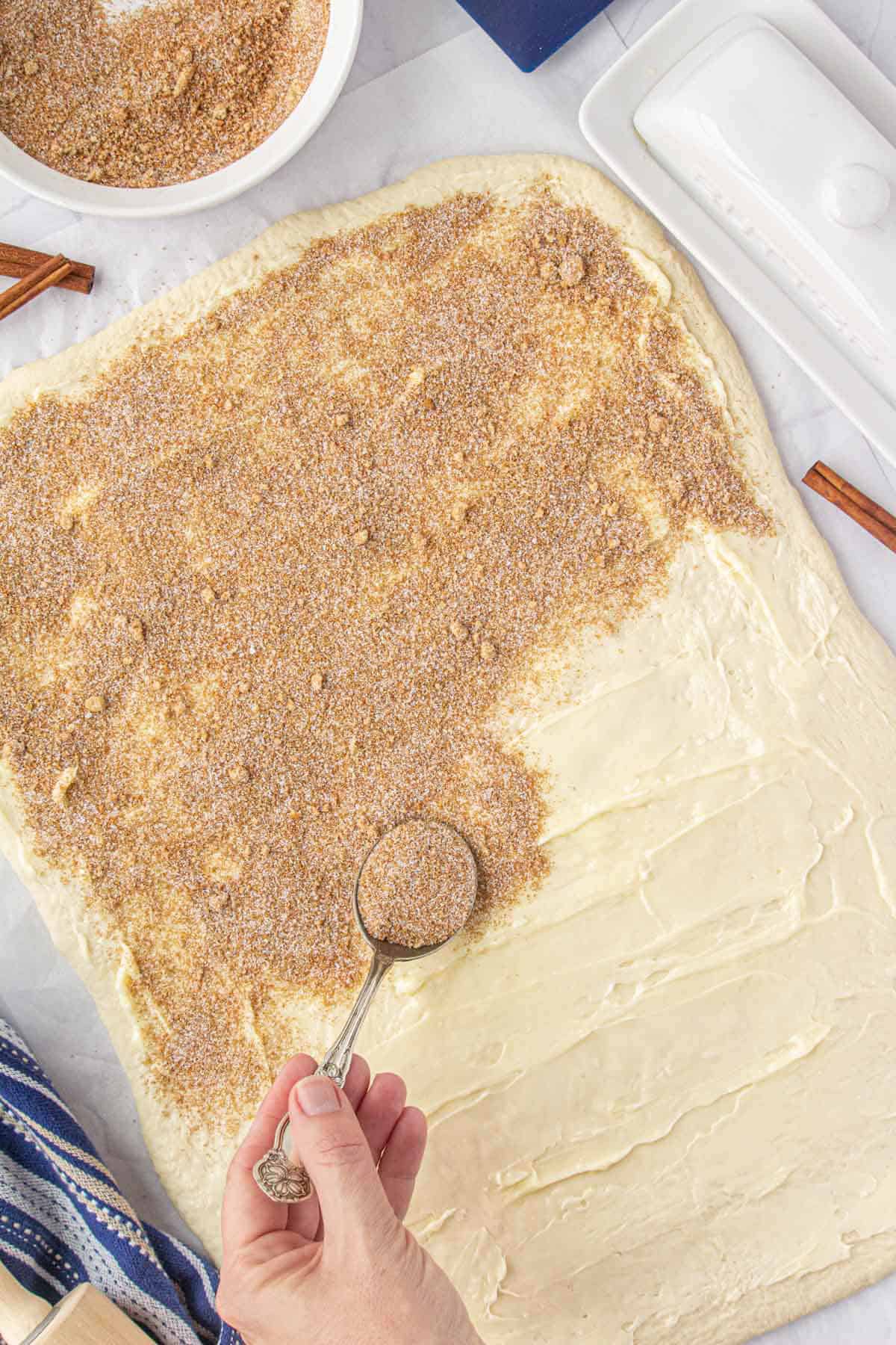 Cinnamon sugar mixture sprinkled on the butter cinnamon roll dough.