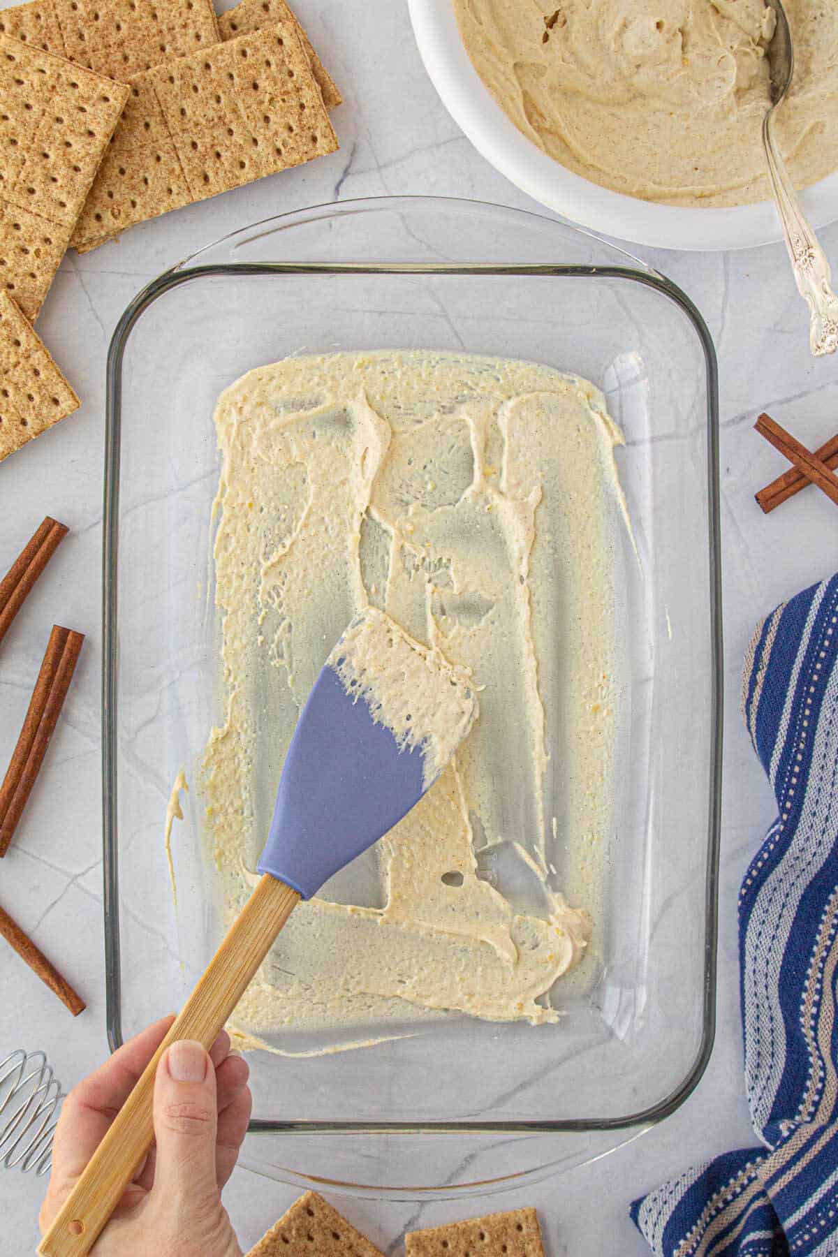 Pudding spread on the bottom of an baking dish.