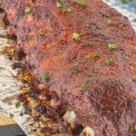A slab of bbq pork ribs that have been slowly cooked in the oven.