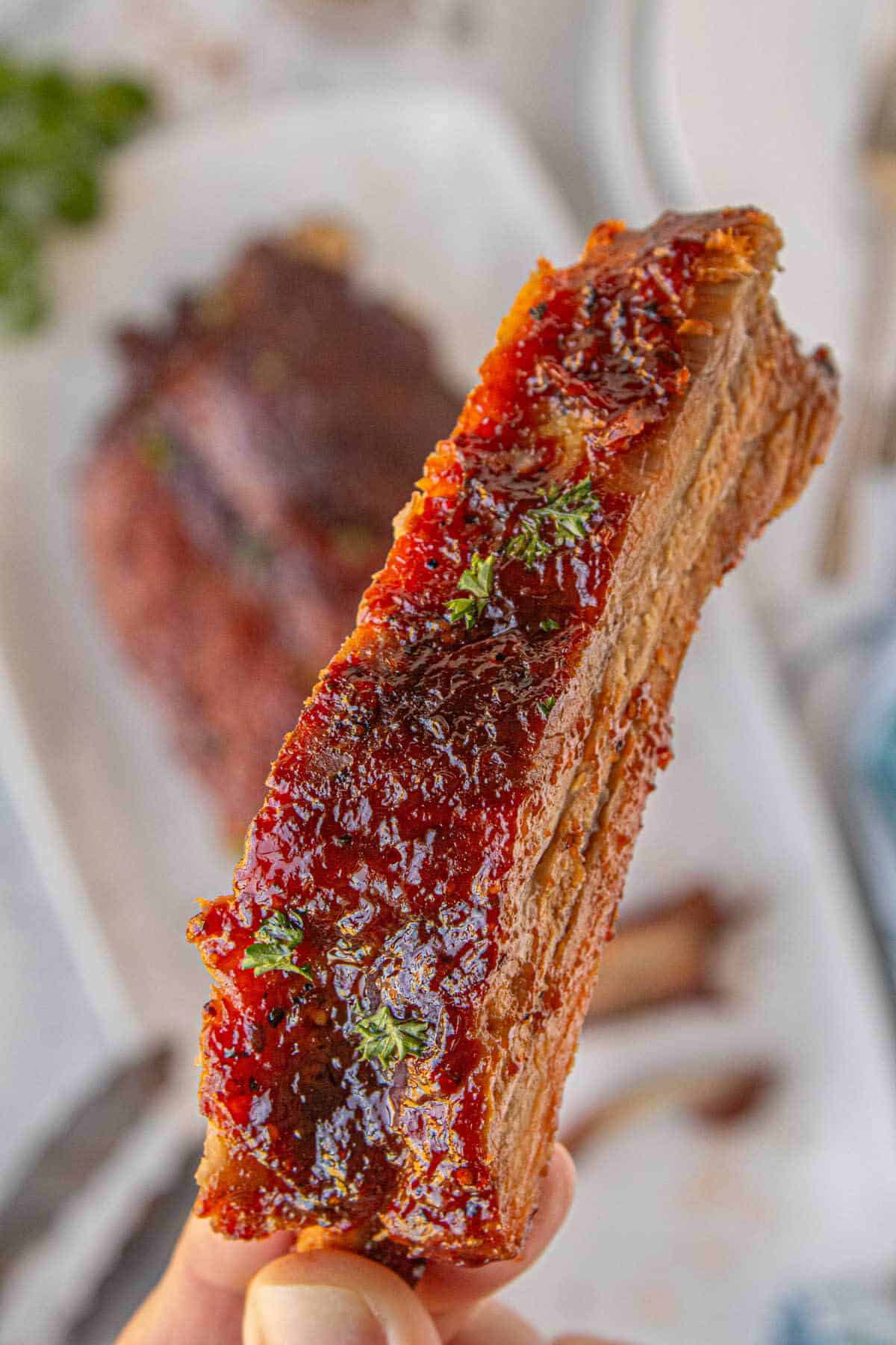 BBQ pork ribs, glossy with sauce and ready to eat.