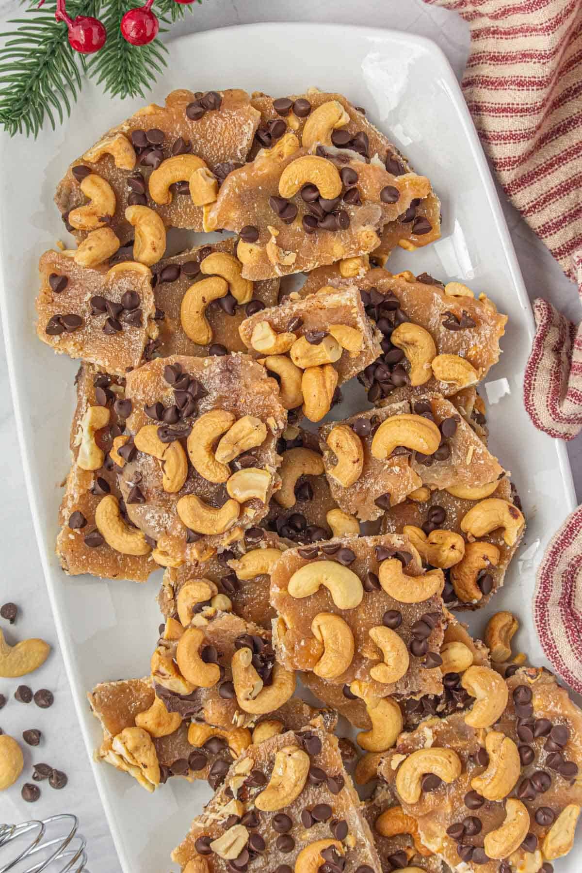 Cashew toffee on a white platter.