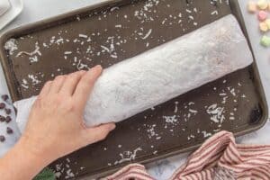 Parchment paper wrapped around a log of Cathedral Window Candy.