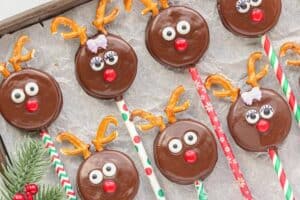 Oreo Reindeer Pops hardening on parchment paper.
