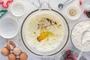 Flour, eggs and vanilla extract in a glass mixing bowl.