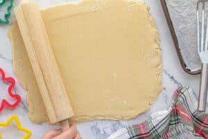 Cookie dough rolled out with a rolling pin.