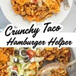 Close-up of cheesy Crunchy Taco Hamburger Helper topped with lettuce, tomatoes, and sliced black olives, served on a white plate with a fork.