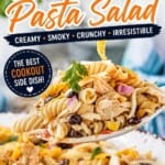 Close-up of creamy BBQ chicken pasta salad with rotini pasta, black beans, corn, shredded chicken, red onion, and crunchy corn chips in a large serving bowl. Bold Pinterest text overlay reads “BBQ Chicken Pasta Salad” and “Perfect for BBQ’s, Potlucks & Summer Cookouts!”.