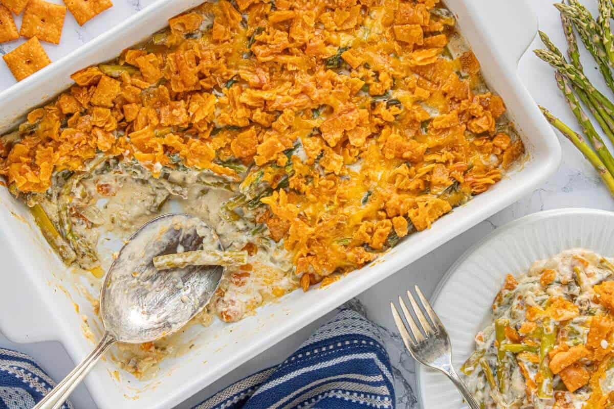 Overhead view of cheesy asparagus casserole fresh from the oven with a crisp, golden topping.