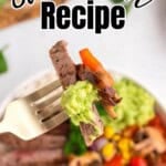 Fork holding a bite of steak, peppers, onion and guacamole over steak, with bold Pinterest overlay.