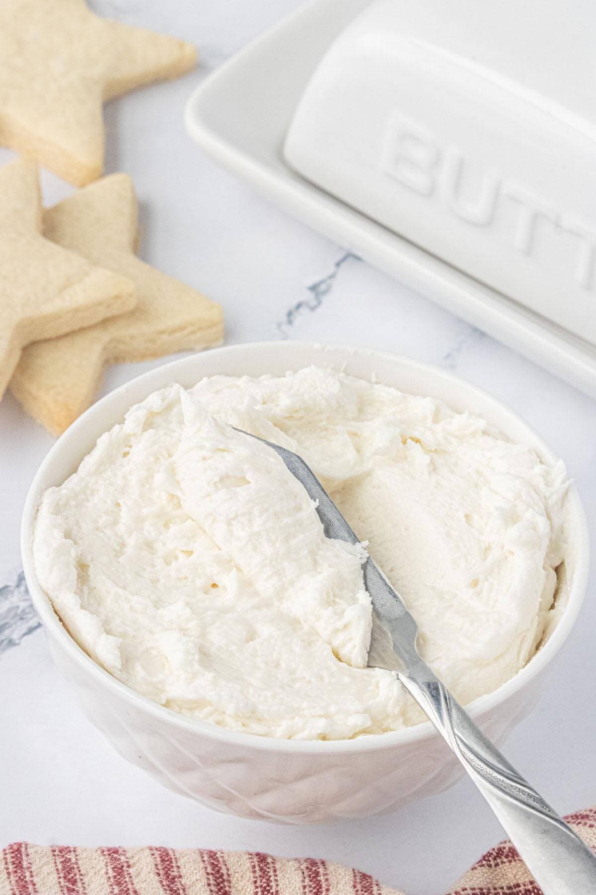 A bowl of buttercream frosting ready to tint for decorating sugar cookies.