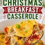 Pinterest pin for Crockpot Christmas Breakfast Casserole featuring a cheesy spoonful of sausage, eggs, potatoes, and roasted red peppers with bold recipe title overlay.