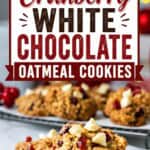 Pinterest pin featuring soft and chewy Cranberry White Chocolate Oatmeal Cookies topped with white chocolate chips and dried cranberries, with a bold text overlay reading "Cranberry White Chocolate Oatmeal Cookies."