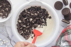 Chopped Oreo cookies folded into a melted white chocolate mixture to make creamy Oreo fudge.