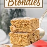 Pinterest pin featuring two soft and chewy Peanut Butter Blondies on a serving spatula above a pan of blondies dusted with powdered sugar, with the text "Peanut Butter Blondies."