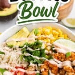 Pinterest pin featuring a colorful Shrimp Burrito Bowl topped with seasoned shrimp, cilantro lime rice, avocado, corn, tomatoes, fresh cilantro, green onions, lime wedges, and a creamy sauce drizzle. Bold text overlay reads "Shrimp Burrito Bowl."