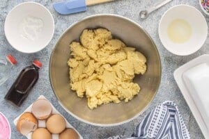 Thick cake mix sugar cookie dough mixed together in a large bowl.