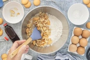 Crushed vanilla wafer cookies and dry cake ingredients are combined in a large mixing bowl before making cake batter.