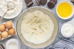 Creamed butter and cream cheese mixture in a mixing bowl.