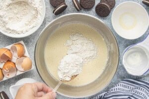 White cake mix being whisked into the Bundt cake batter.