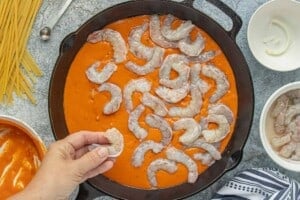 Raw shrimp added directly to the creamy vodka sauce to cook.